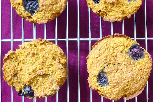 pumpkin muffins with blueberries in the oven